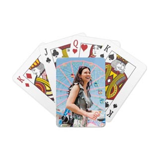 Playing Cards: A deck of playing cards with one card showing a custom back featuring a photo of a woman at a carnival.
