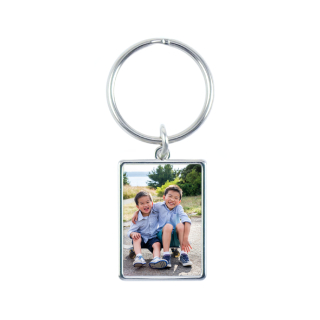 Rectangular metal keychain personalized with a custom photo, great for identifying backpacks.