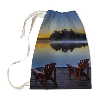 Laundry Bag: A drawstring laundry bag personalized with a photo of a misty lake at sunrise.