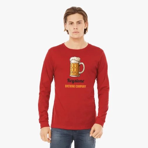 Unisex Long Sleeve Tee - Red, Size S: A model wearing a red long-sleeve shirt with a custom Keystone Brewing Company beer mug logo.