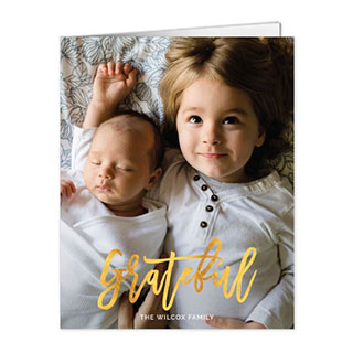 notecards: A photo notecard of two siblings with the word grateful in a gold script.