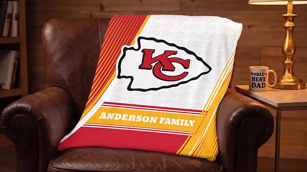 Custom photo gifts for dad featuring a Kansas City Chiefs personalized fleece blanket with Anderson Family text.