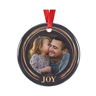 Ornaments: A round ceramic ornament with a personalized photo of a father and daughter and the word JOY.