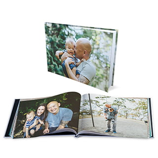 8x11 Hardcover Photo Books: A hardcover photo book with a photo of a father and baby, shown closed and open to an inside spread.