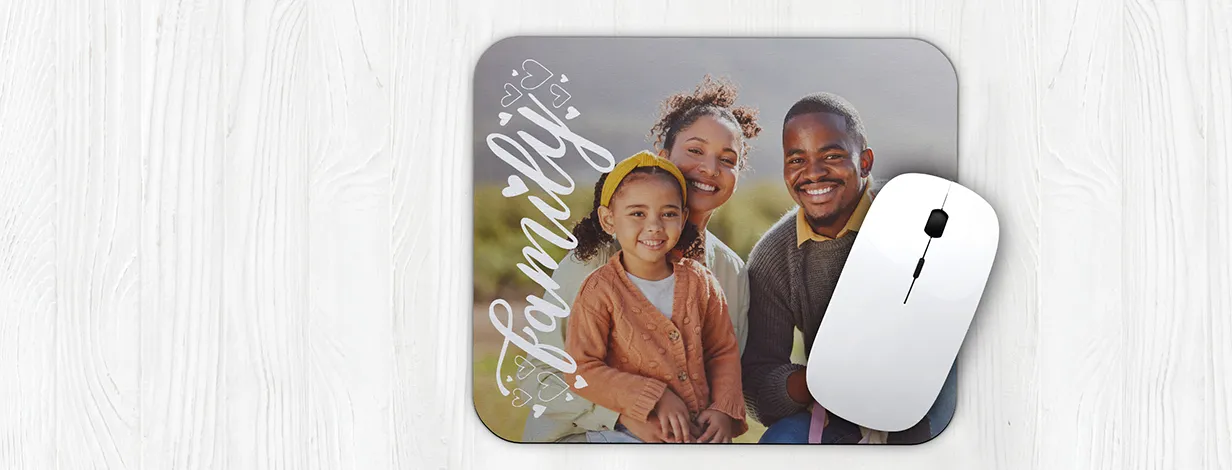 shop mouse pads: A personalized mouse pad with a full family photo and the word Family in a script font.