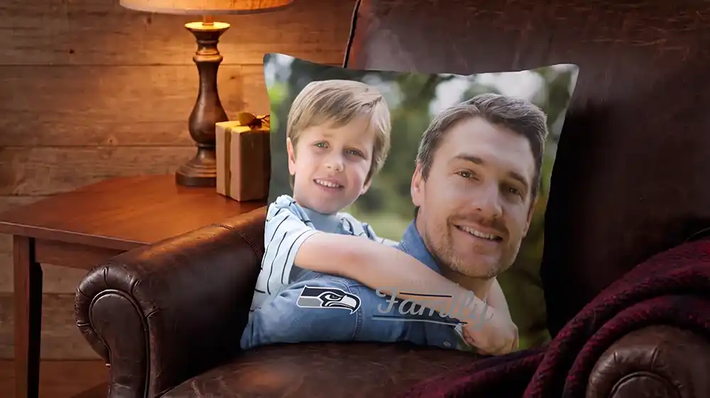 Personalized Father's Day gifts showing a Seattle Seahawks custom photo pillow on a leather armchair.