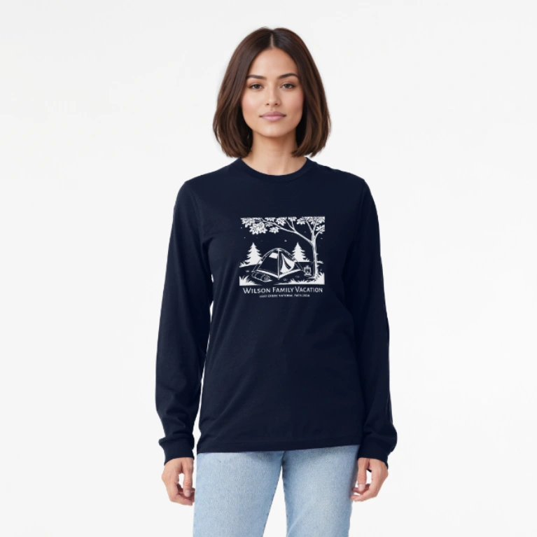Long Sleeve Tee: A model wearing a blue long-sleeved shirt with a personalized family vacation graphic of a camping scene.