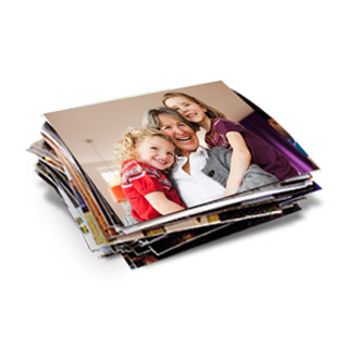 1hr Prints: A stack of square photo prints with the top photo showing a grandmother and her two granddaughters.