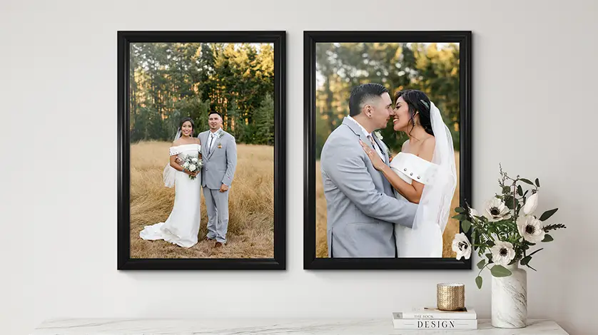 Two large-format wedding picture prints in elegant black frames for a professional gallery wall layout.