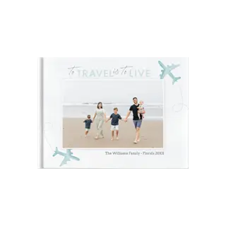 Photo Books: The cover of a square photo book with a family beach photo and a travel theme.