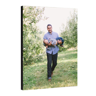 11x14 Mounted Prints: A vertical mounted print with a full-bleed photo of a father carrying his child.