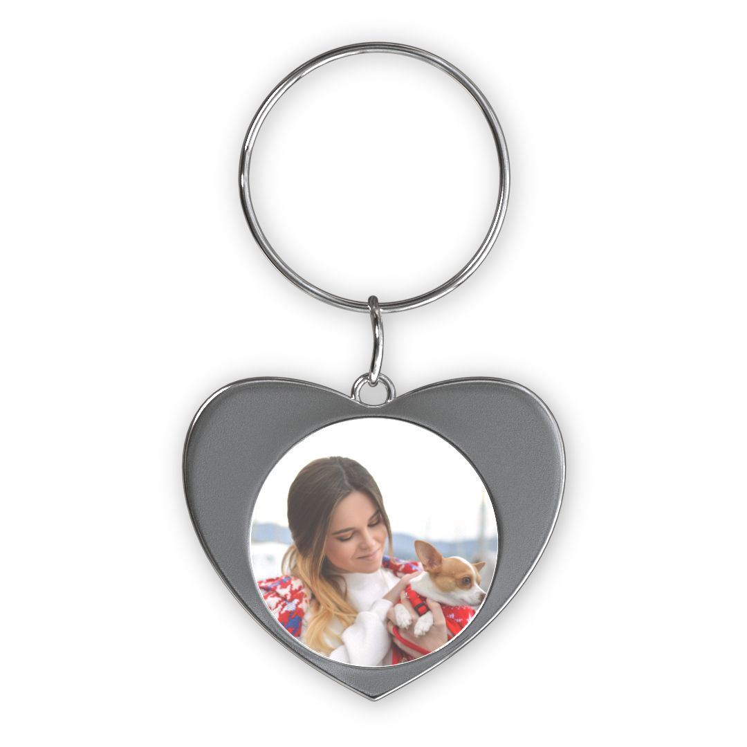 Silver Heart Keychain: A heart-shaped keychain with a circular photo of a woman and her dog.