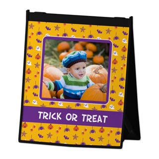 Reusable Tote Bags: A tabletop easel frame with a Halloween pattern, a photo of a baby, and the text Trick or Treat.