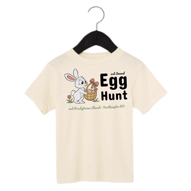 Toddler Tee: A toddler sized beige t-shirt with a personalized easter design.