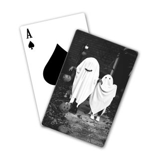 Playing Cards: A playing card with a personalized back featuring a black and white photo of people in ghost costumes.