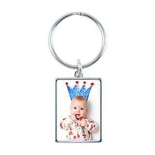 Keychains: A rectangular metal keychain with a photo of a baby with a hand-drawn crown.