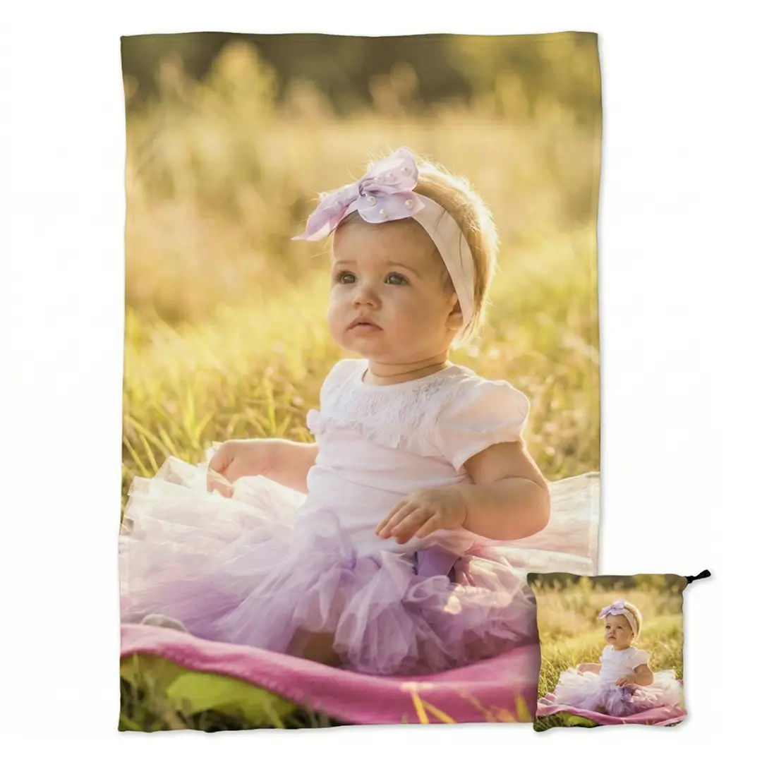 Custom photo travel blanket for a baby's first birthday gift.