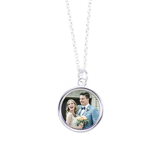 Round Necklaces: A silver necklace with a round pendant featuring a photo of a bride and groom.