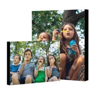 Mounted Prints: Two mounted photo prints of different sizes, featuring pictures of children playing.