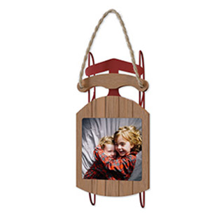 Wooden Sled: An ornament shaped like a miniature wooden sled that holds a photo of two children.
