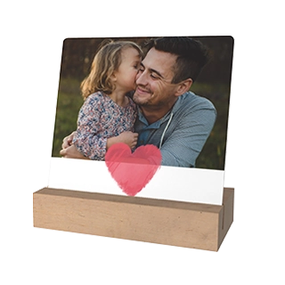 Unique Desk Art: A personalized photo display of a father and daughter in a high-quality wooden block stand.