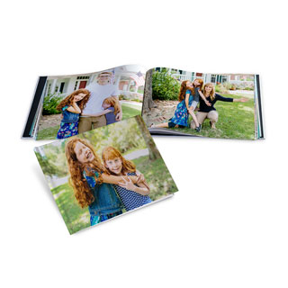 Square photo book shown open and closed, ideal for compiling a year of academic milestones.