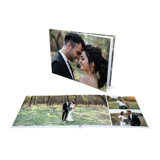 Photo Book: A layflat wedding photo book shown closed with its photo cover, and open to an inside spread.