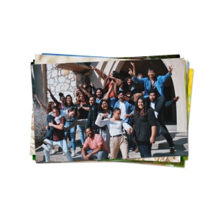 Stack of custom photo prints, essential for personalized dorm room decor.