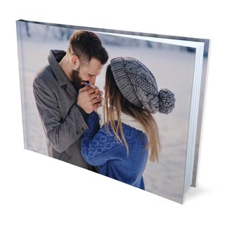 Photo Books: A hardcover photo book with a full wrap-around photo of a couple in winter.