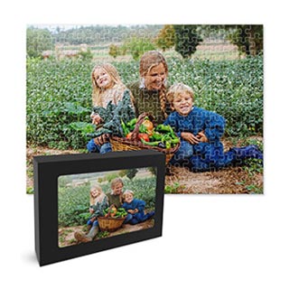 Puzzles: A completed jigsaw puzzle of a mother and two children in a garden, shown with its storage box.
