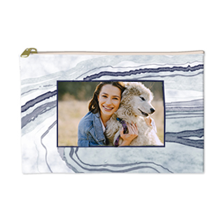 Zippered accessory pouch for organizing pens and tech accessories.