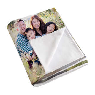 Blankets: A folded photo blanket showing a family picture on the front and the soft fleece backing.