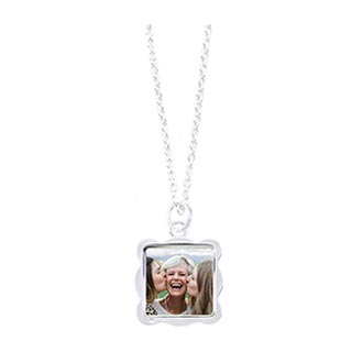 Necklaces: A silver necklace with a square, wavy-edged pendant featuring a photo of a grandma and her granddaughters.