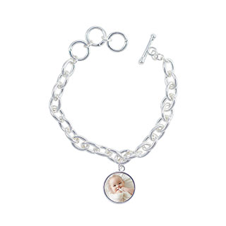 Round Bracelet: A silver link charm bracelet with a round photo charm of a baby.