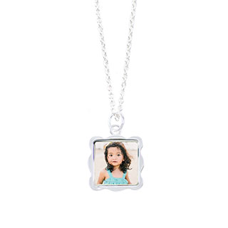 Wave Necklace: A silver necklace with a square, wavy-edged pendant featuring a photo of a young girl.