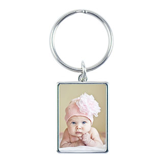Vertical Keychain: A rectangular metal keychain with a photo of a newborn baby.