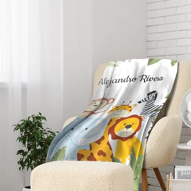 Custom photo blanket folded over a couch, a cozy personalized gift idea.