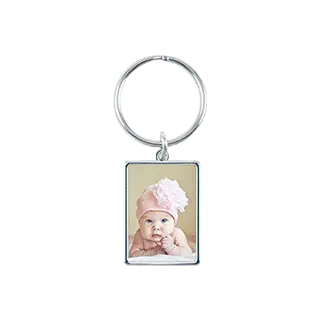Keychains: A rectangular metal keychain with a photo of a newborn baby.
