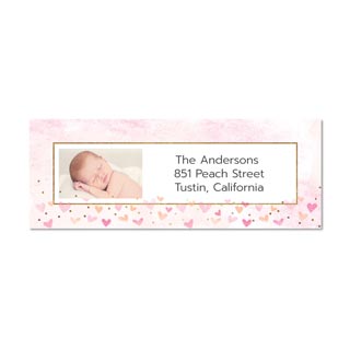 Address Labels: A personalized return address label with a pink heart design and a photo of a newborn baby.