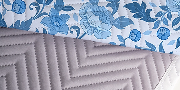 Custom quilted photo blanket showing patterned stitching.