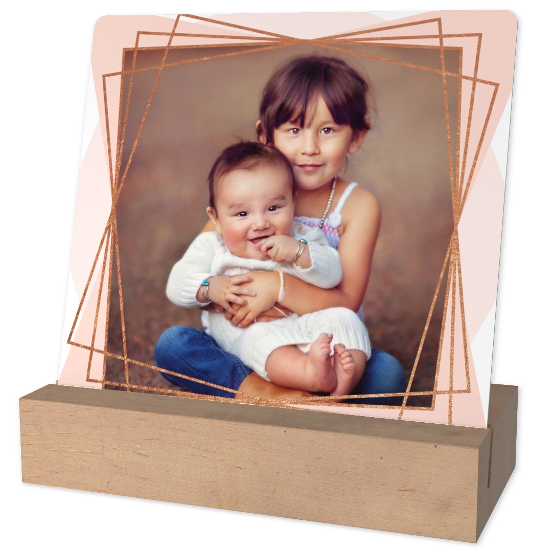 Metal Desk Art: A desktop metal print of two siblings, decorated with a rose gold geometric frame.