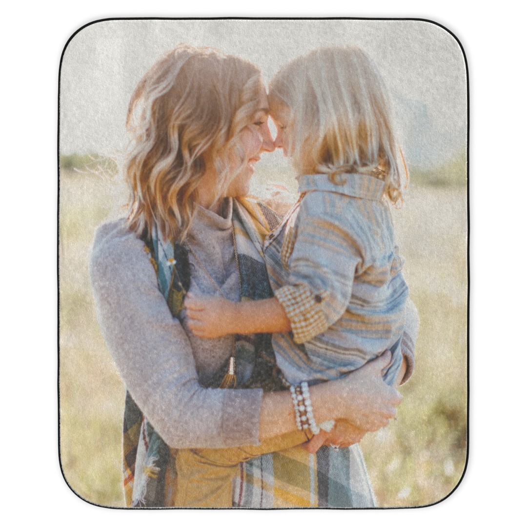 Stadium Blanket: A personalized photo stadium blanket featuring an outdoor portrait of a mother holding a young child, touching foreheads.