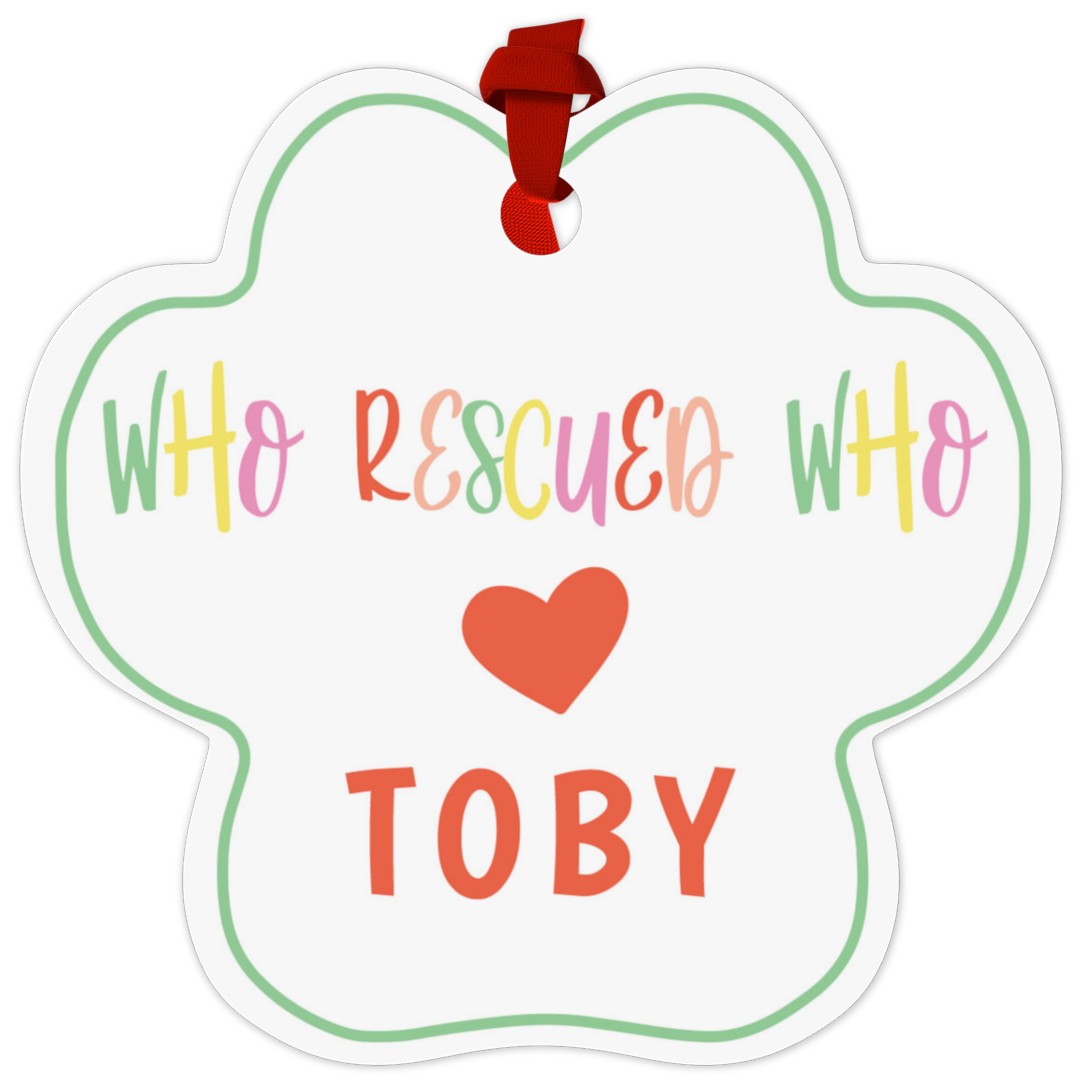 Paw Metal Ornament: A paw print-shaped ornament for a pet with the text Who Rescued Who and a custom name.